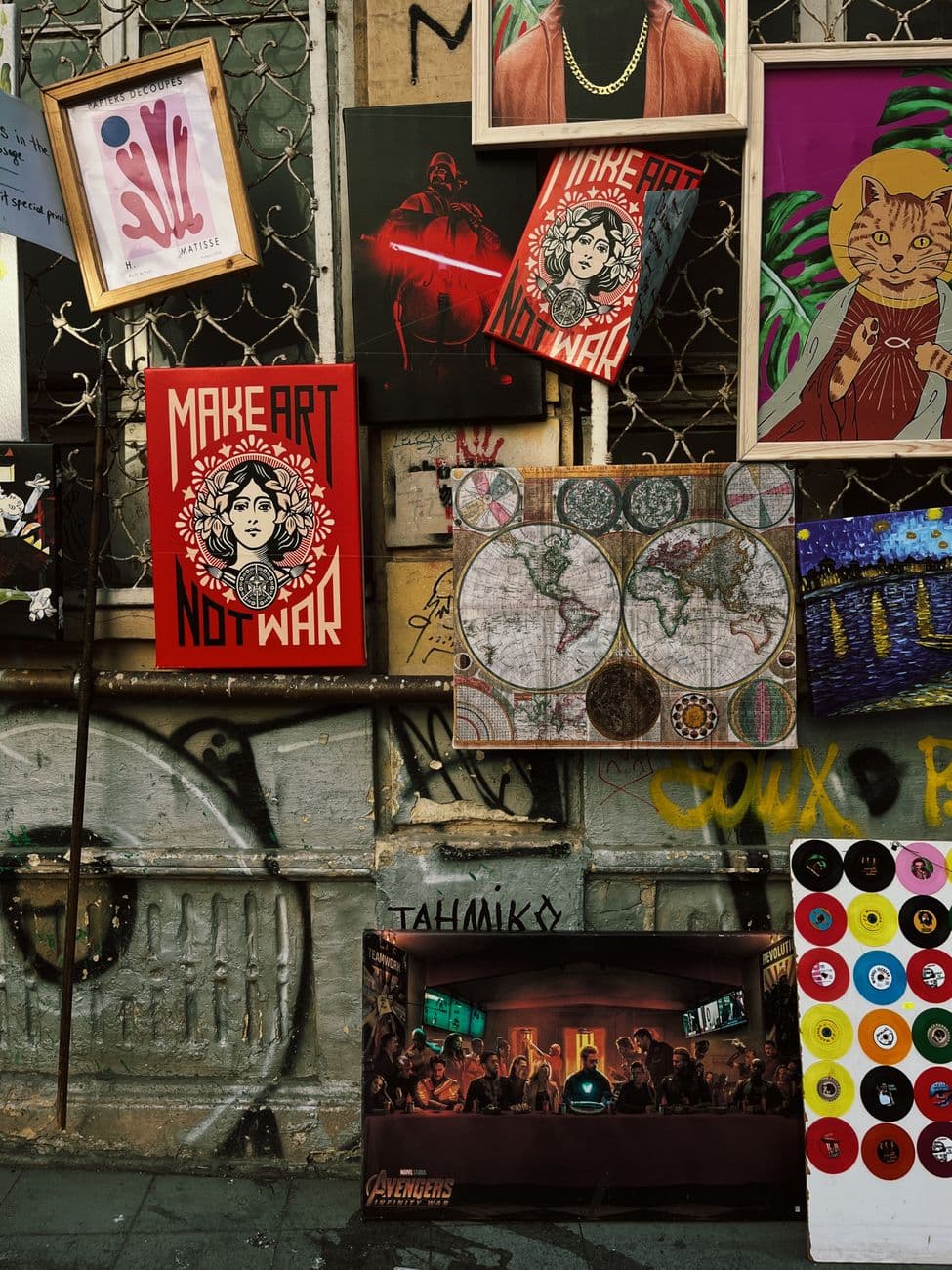 Colorful street art and posters on a wall in İstanbul, Türkiye showcasing creativity.