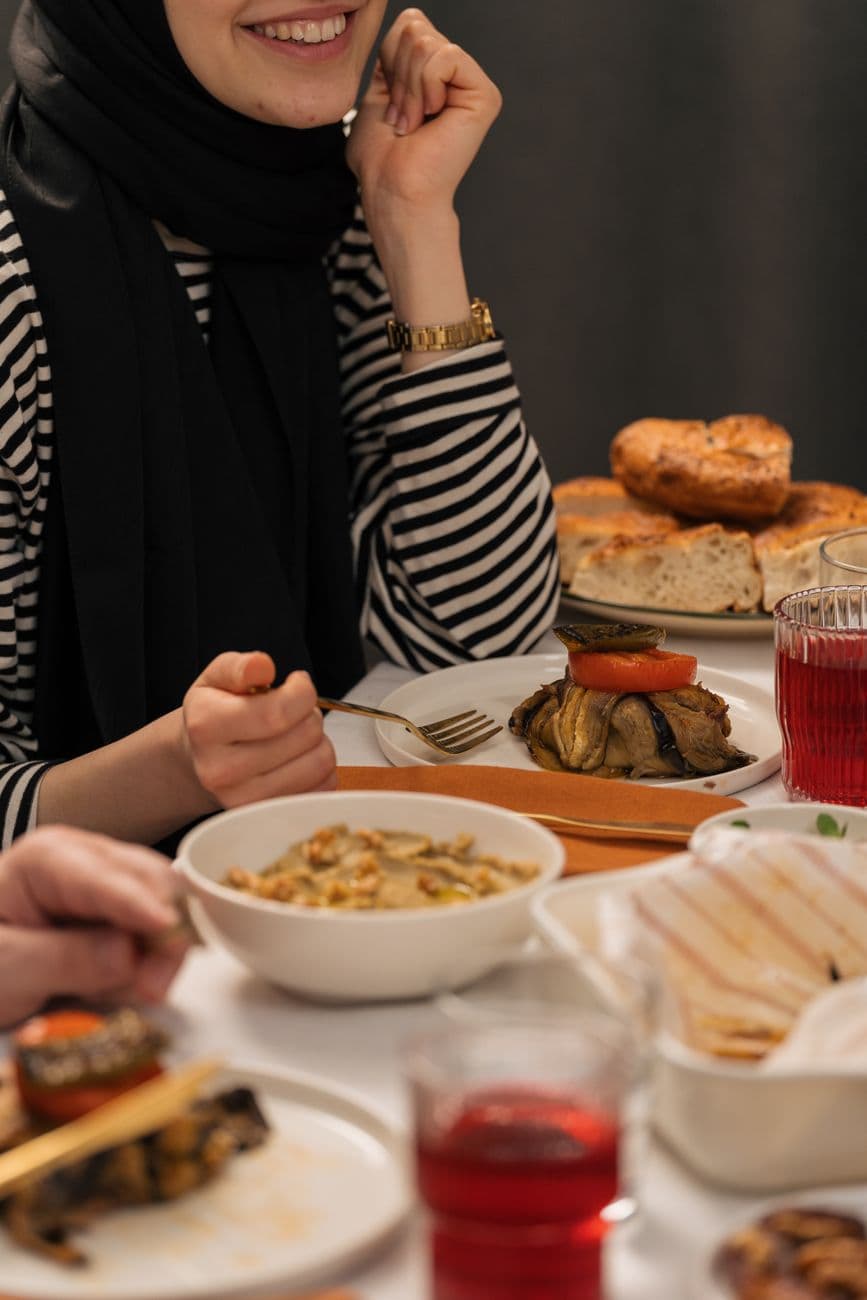 A group of friends dining together, sharing delicious meals and smiles.