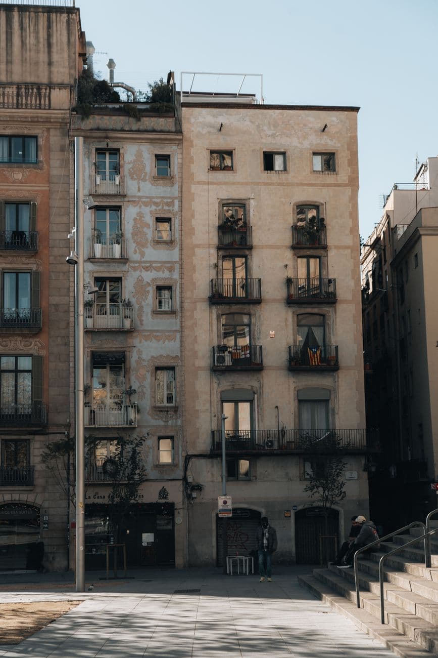 Charming urban scene of historic apartments in Barcelona's vibrant cityscape.